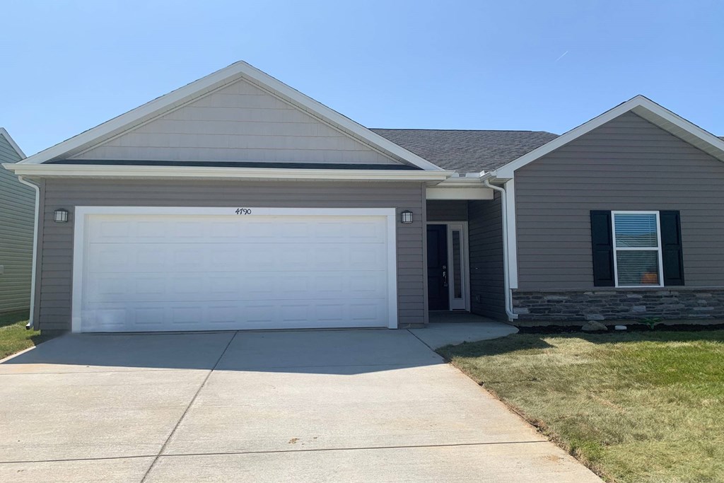 a house with a white garage door